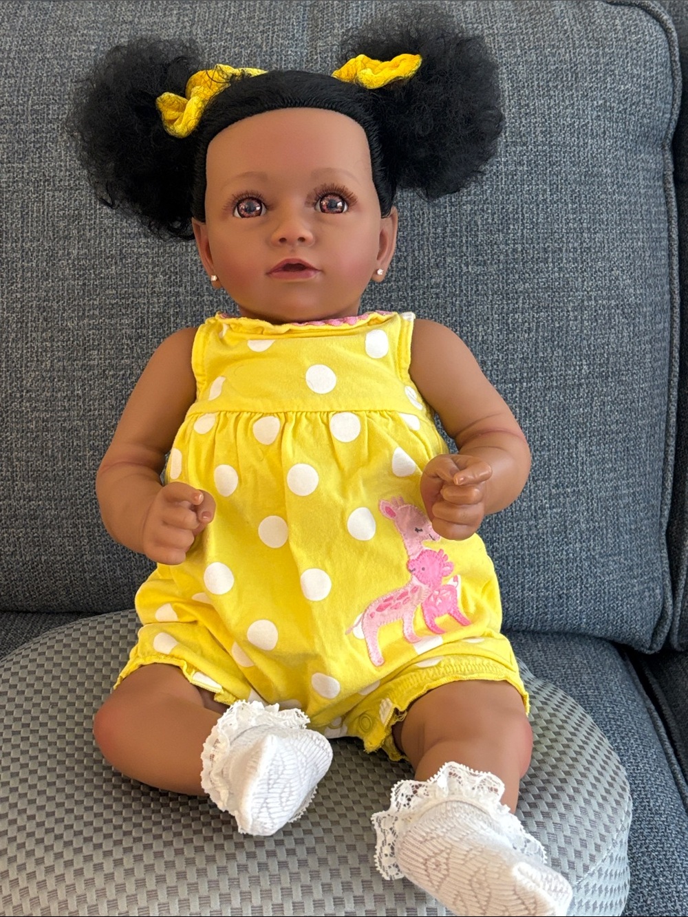 Adorable Baby Doll in Yellow Polka Dot Romper